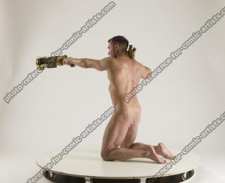 2020 01 MICHAEL NAKED MAN KNEELING POSE WITH GUNS (6)